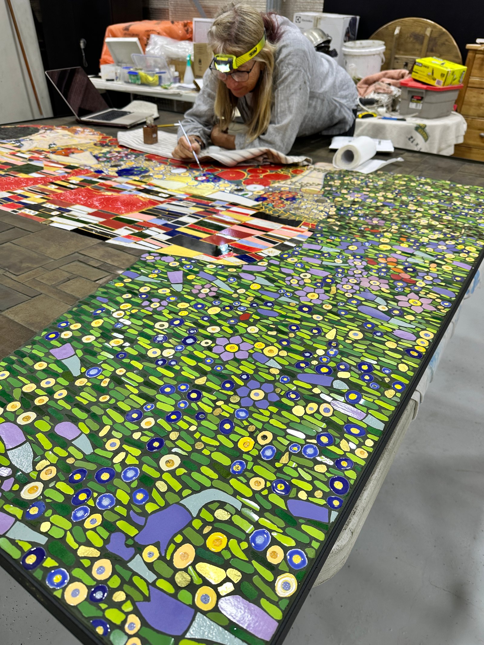 Kari gilding the mosaic